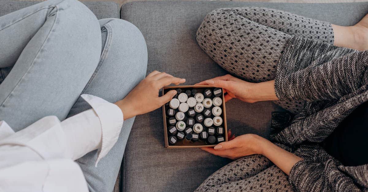 A hand holding a remote control