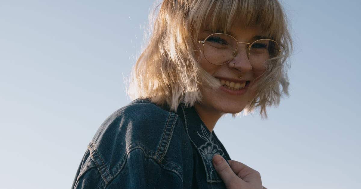 A close up of a person wearing a blue shirt