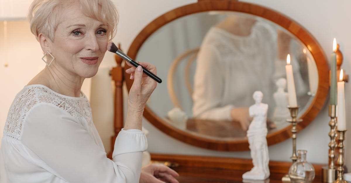 A woman holding a toothbrush