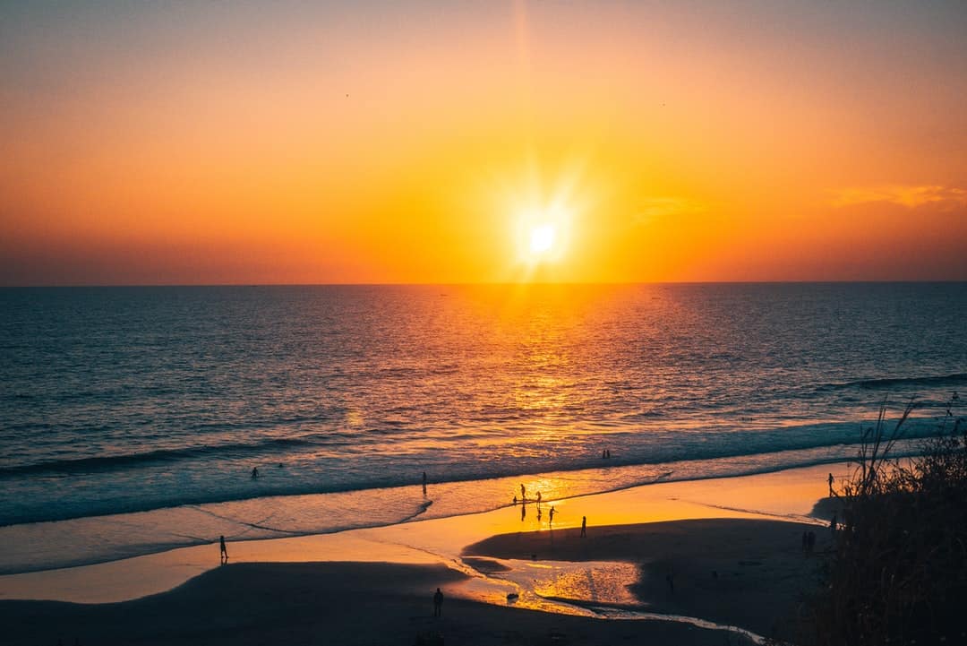 A sunset over a body of water