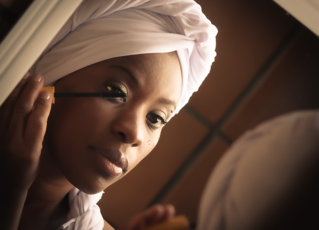 A close up of a person wearing a hat