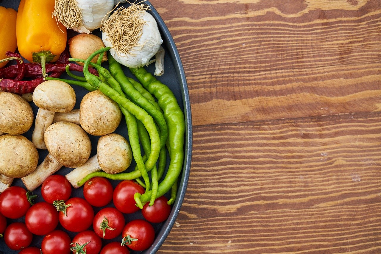 A bowl of fruit sitting on a table