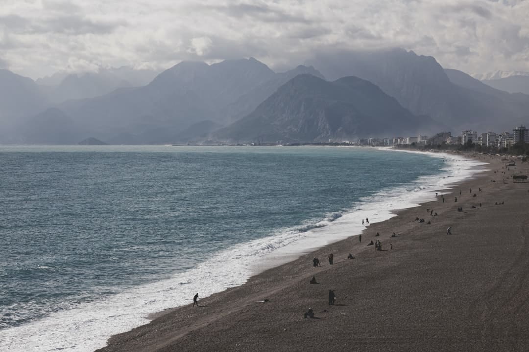 A beach with a mountain in the background