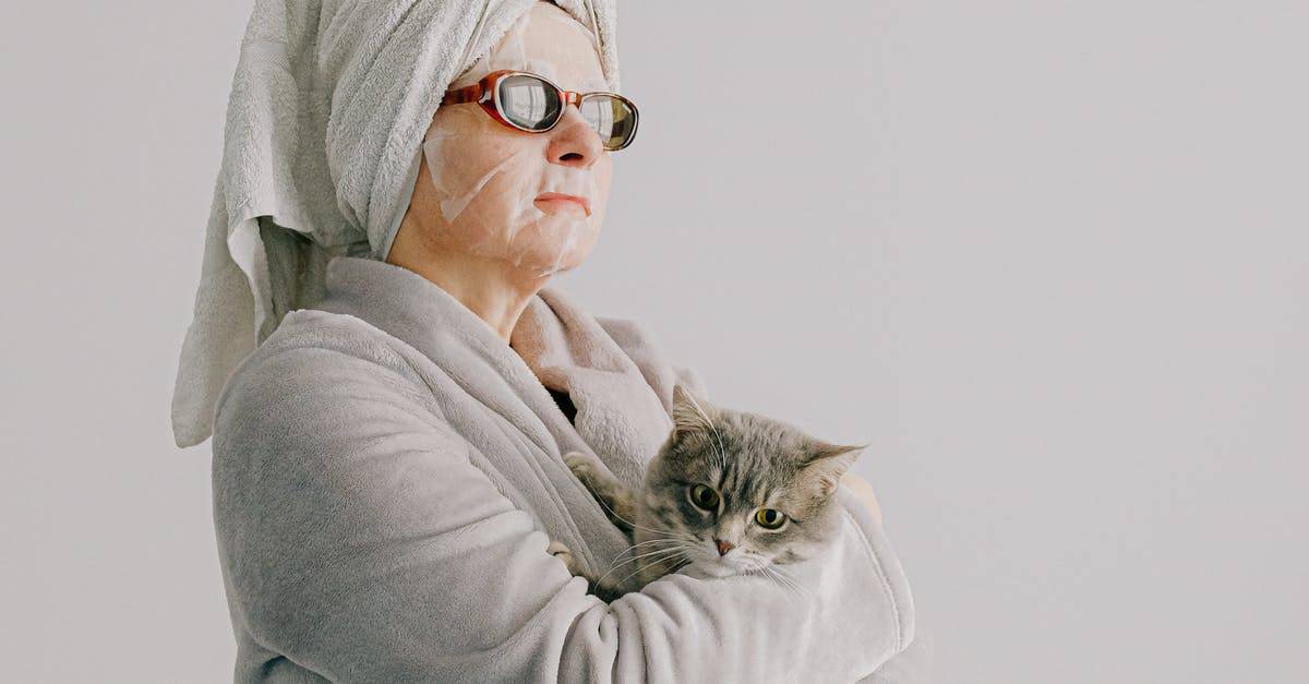 A person holding a cat