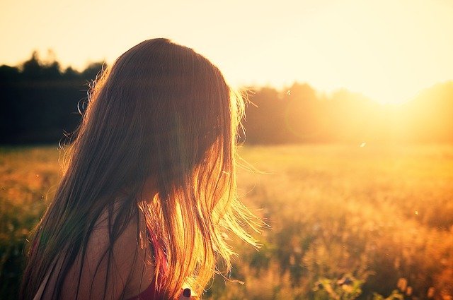 A person standing in front of a sunset