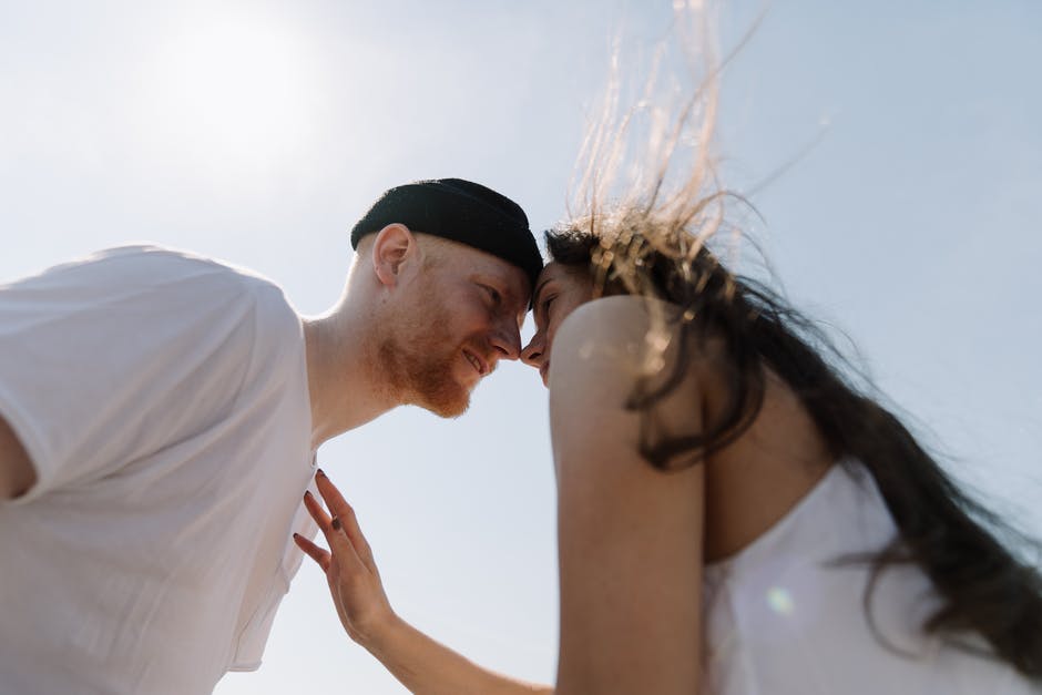 A man and a woman looking at the camera