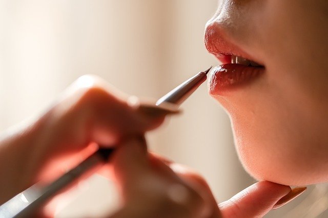 A close up of a person brushing their teeth