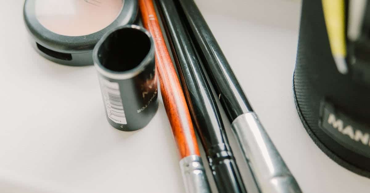 A close up of a cup with a toothbrush