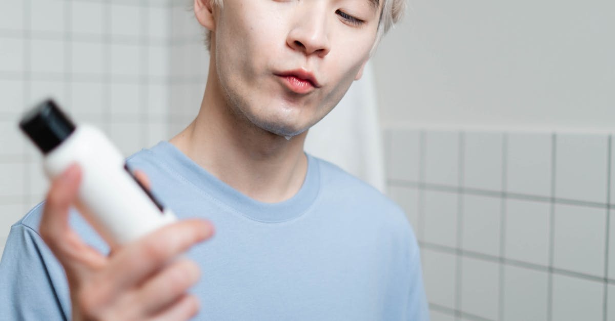 A person holding a toothbrush